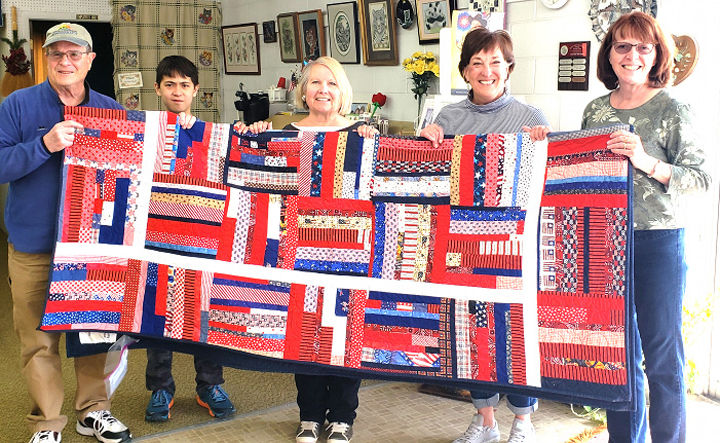 Quilt presented to disabled veteran